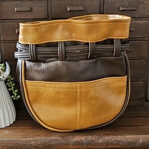 Vintage Style Two-tone brown and tan Faux leather drawstring bag.